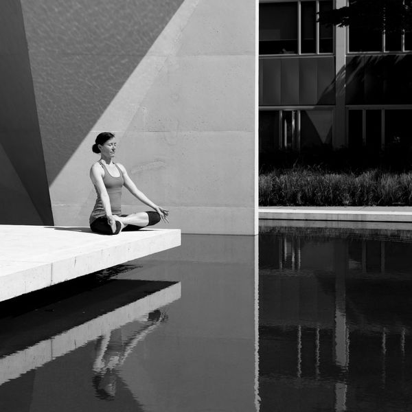 A person meditating peacefully outdoors, symbolizing mental clarity.